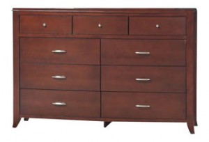 A dresser with nine drawers and chrome handles.