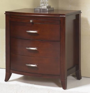 A wooden dresser with three drawers and a metal handle.