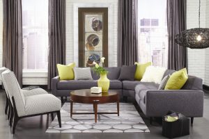 A living room with gray and yellow furniture